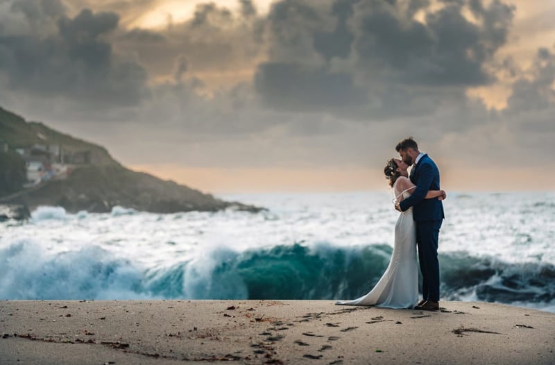 Sea waves swirling in the background of a newlty wedded couple picture