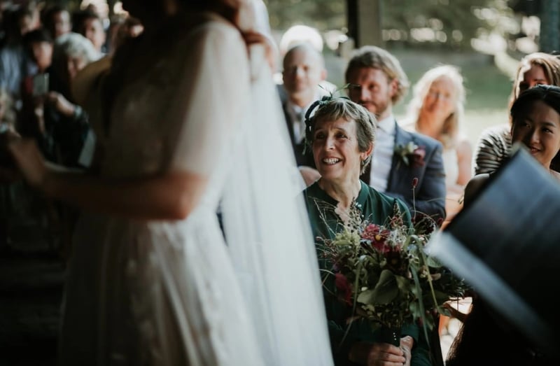 mother of the bride looking at the couple during the ceremony