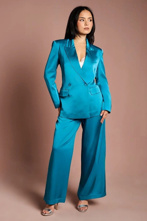 model in satin blue trouser suit