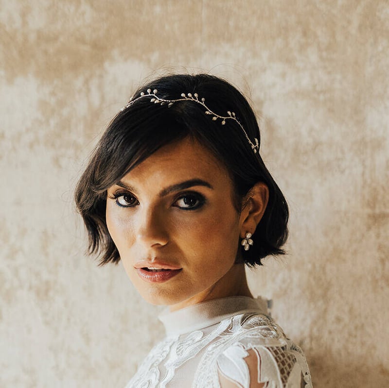 woman with short brown hair wearing a wedding hair wine