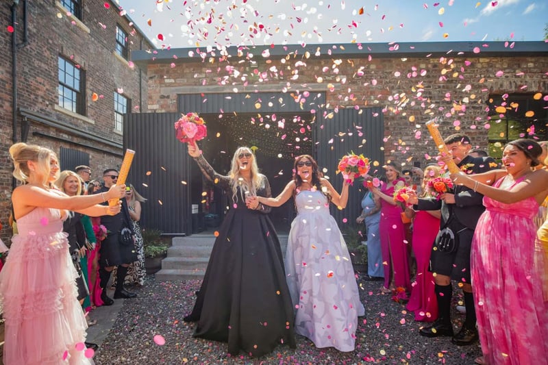 LGBTQ+ wedding with couple surrounded by confetti