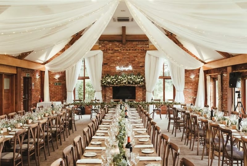 A wedding reception set up at westerham golf club with long banqueting tables, ready for a wedding fair