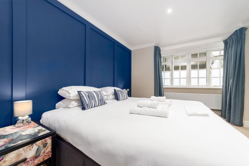 a large comfortable bed inside a hotel room.