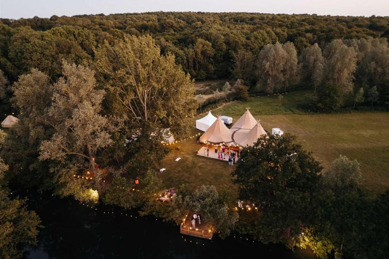Rustic tipi style wedding marquee in an orchard from above