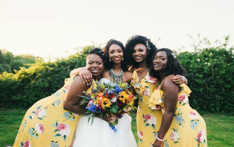 bride with three bridesmaids in butter yellow bridesmaid dresses