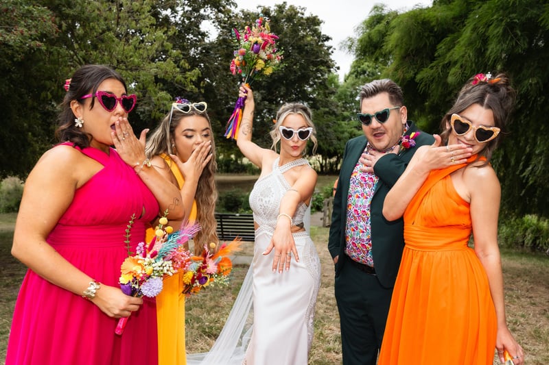 a fun group shot with colourful outfits and sunglasses. 