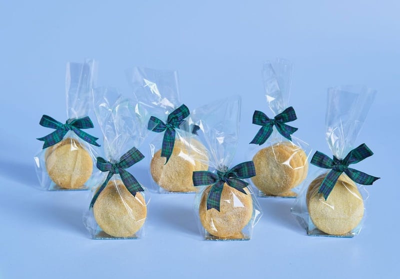 traditional scottish shortbread wrapped in cellophane and tied with tartan ribbon.