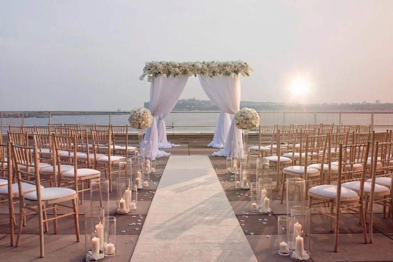 An outdoor wedding ceremony with a sea view