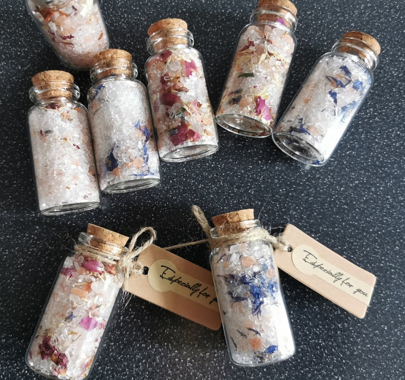 homemade bath salts in little jars with cork lids and personalised labels.