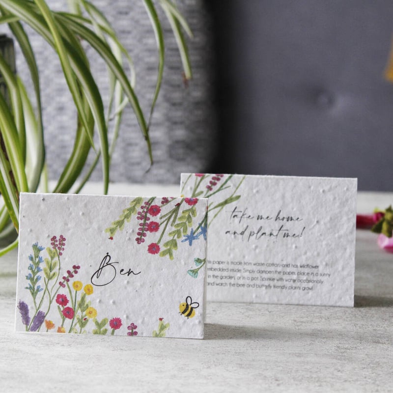 plantable place cards featuring a wildflower print on a table.