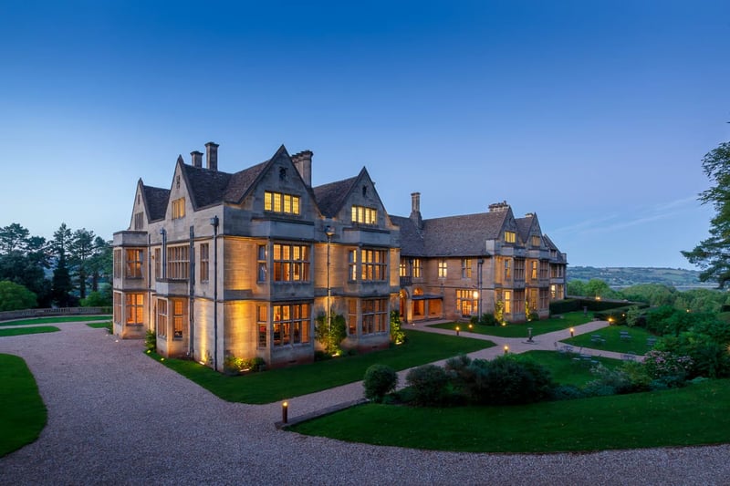 Coombe Lodge exclusive-use wedding venue exterior lit up at dusk, Somerset