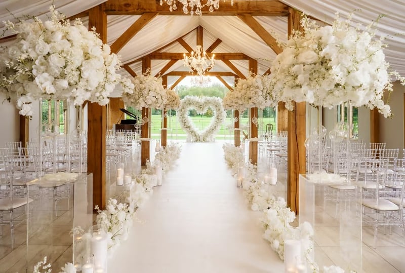 A wedding ceremony set up at Merrydale Manor with a white floral lined aisle