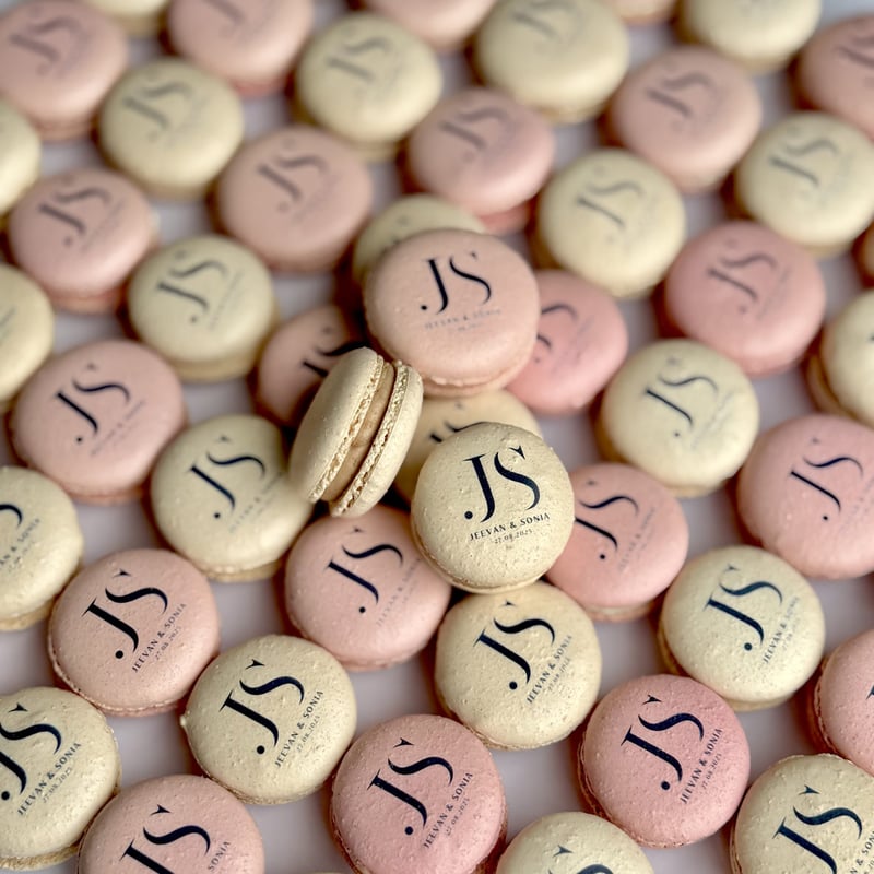 a selection of pink and cream personalised macarons