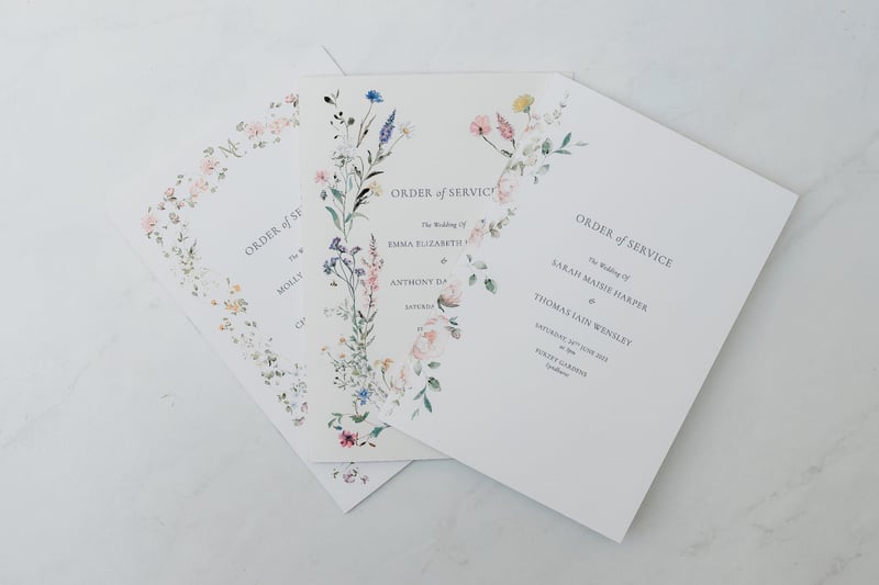 floral order of service cards on a white background.