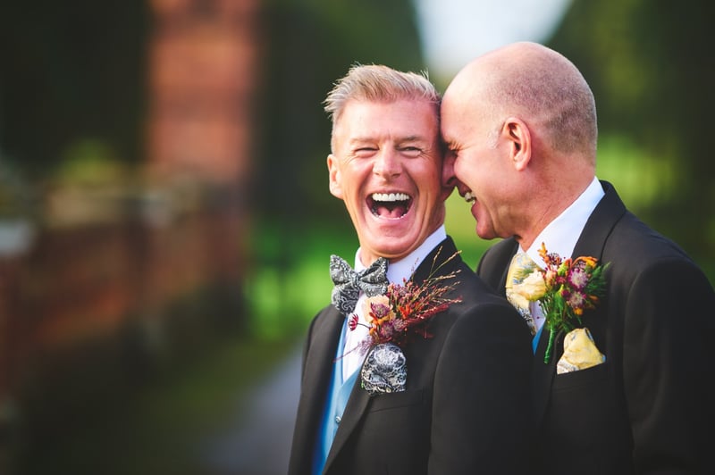 two grooms laughing 