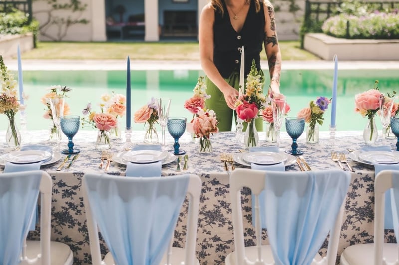 wedding coordinator setting up wedding breakfast 