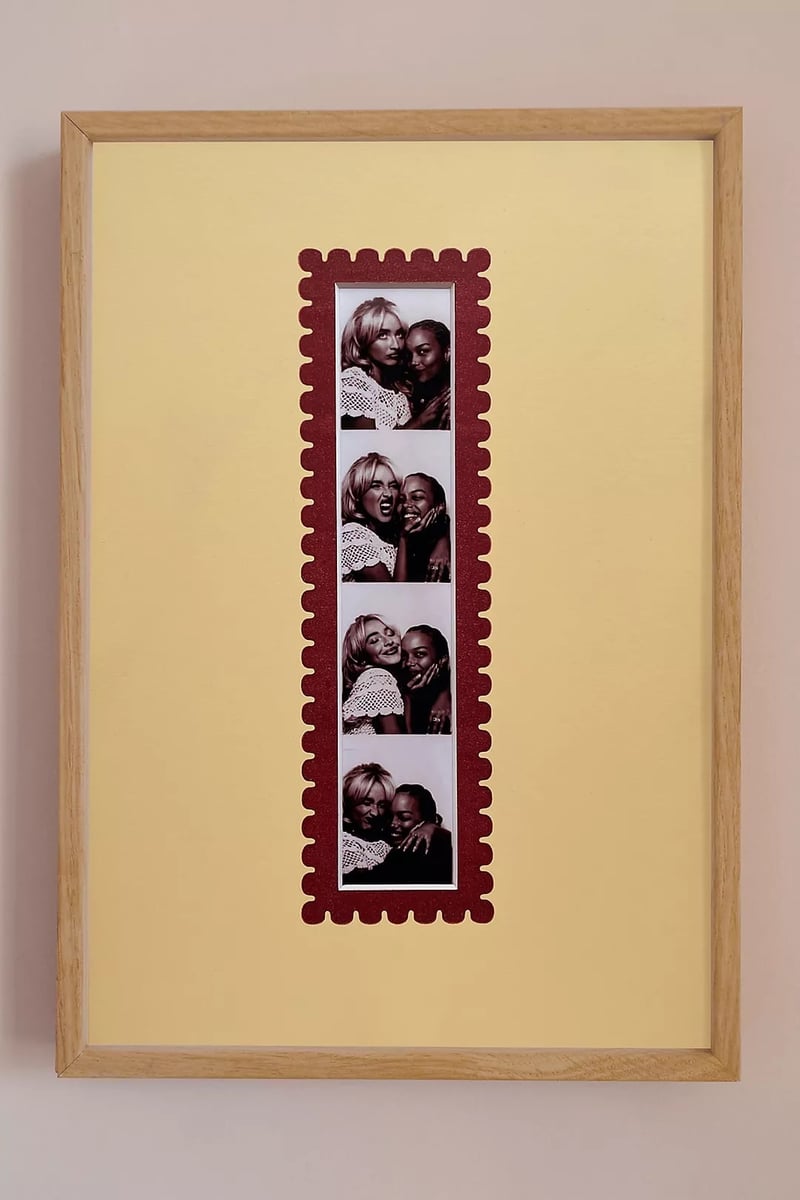 a photo frame that looks like a photo booth strip.