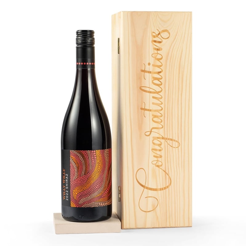 a bottle of red wine and a wooden box engraved with 'congratulations'