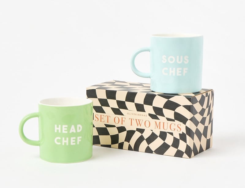 a set of two colourful slogan mugs.
