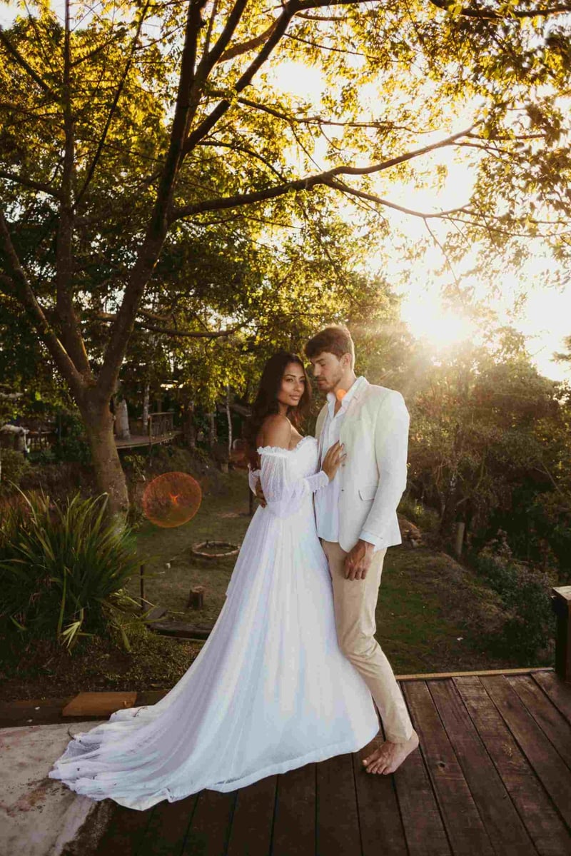couple posing outside in their backyard after getting married