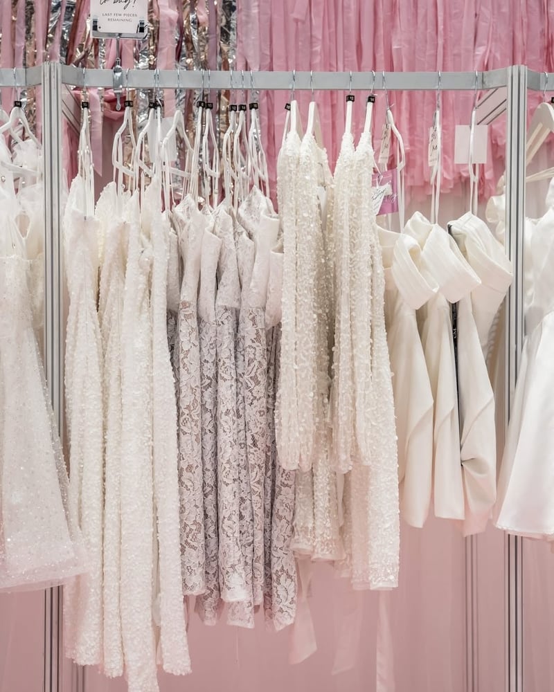 a rail of white dresses at The National Wedding Show