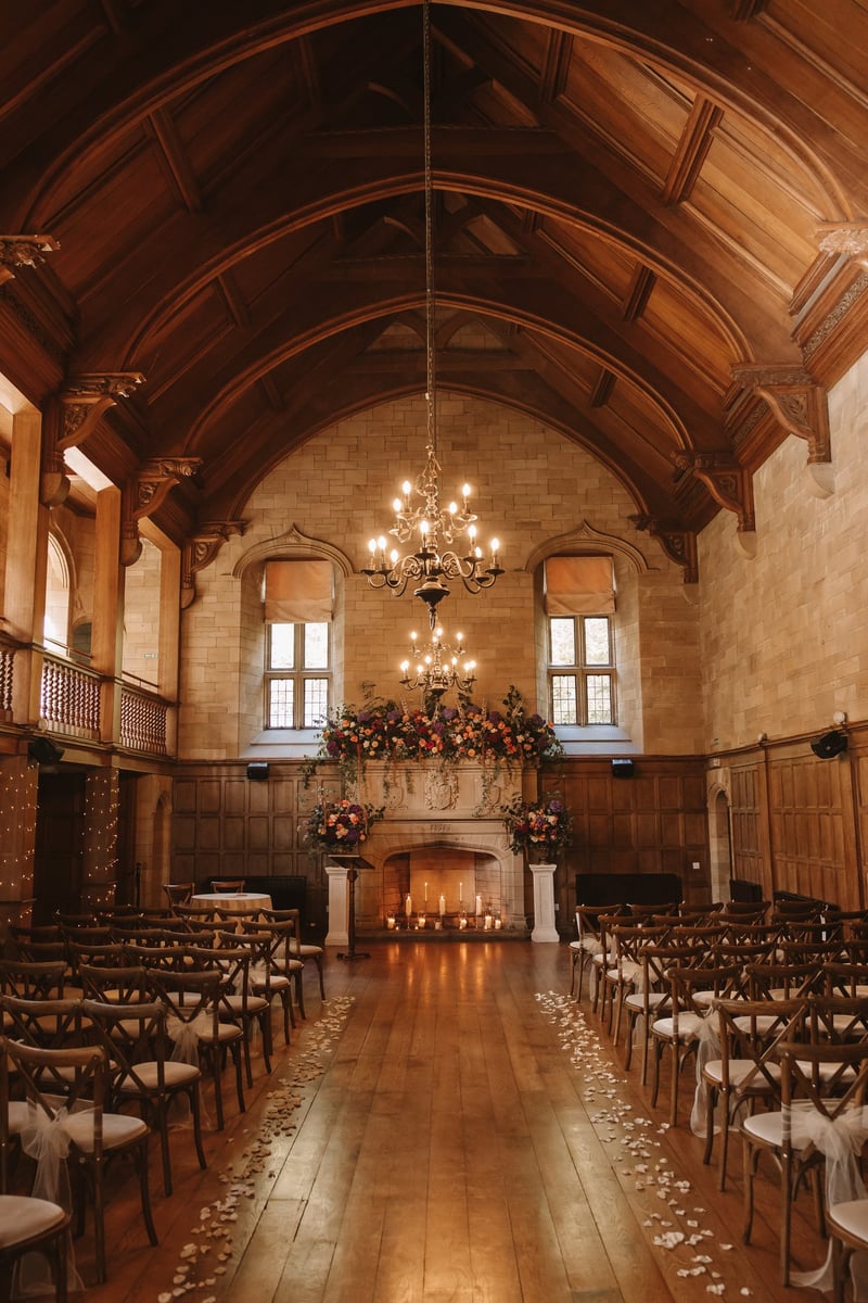 interior of a castle wedding venue with vaulted ceilings and medieval style chandelier.