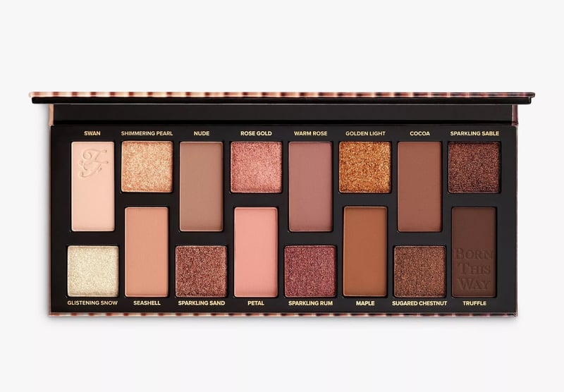 an open eyeshadow palette featuring a wide range of neutral shades.