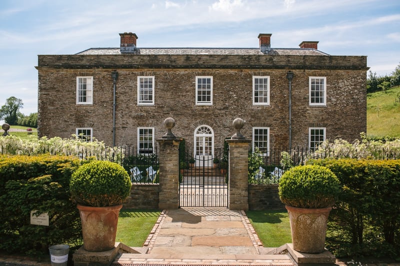 exterior of a Georgian manor house wedding venue in autumn.
