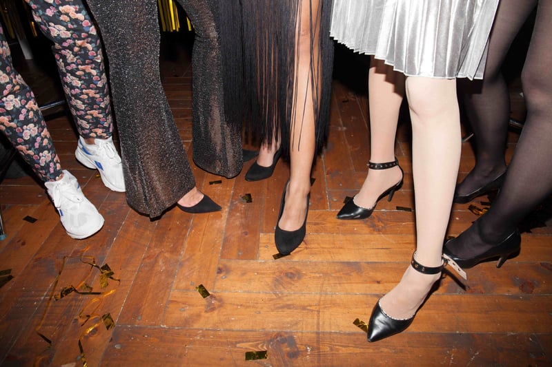 a close-up of guests' feet on the dance floor.
