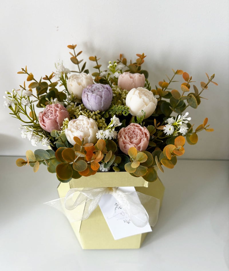 a pastel-coloured bouquet of flowers made from wax 