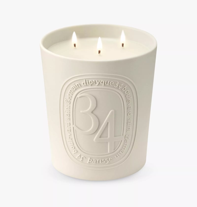 a luxury engraved cream candle from Diptyque 