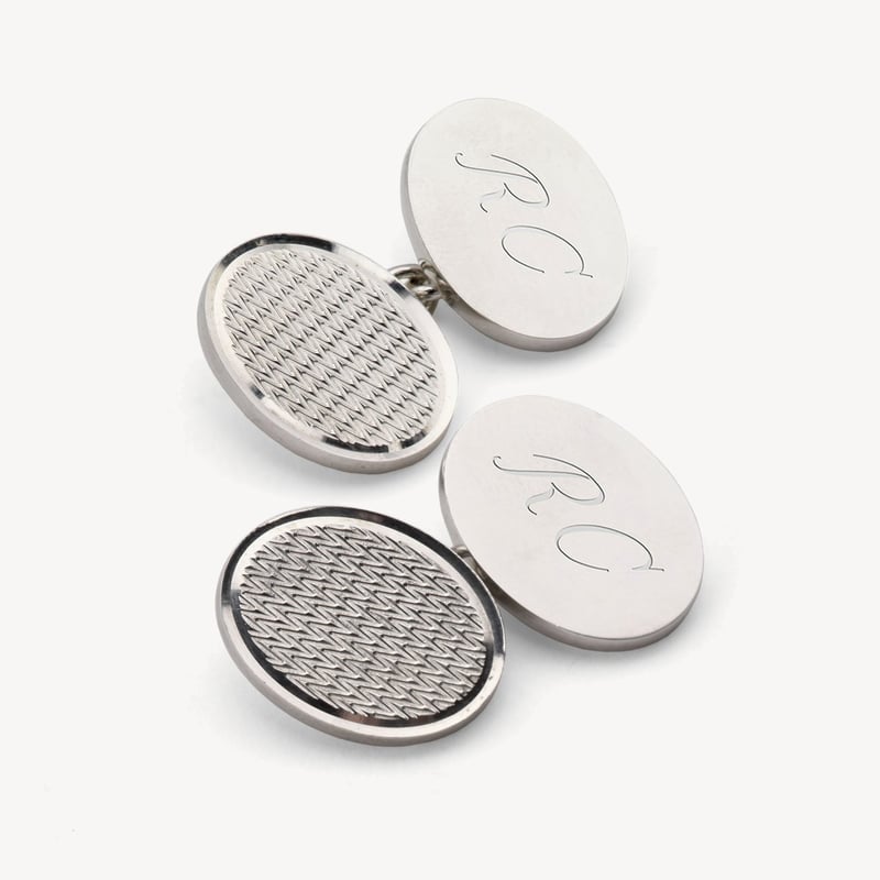 a pair of sterling silver engraved cufflinks