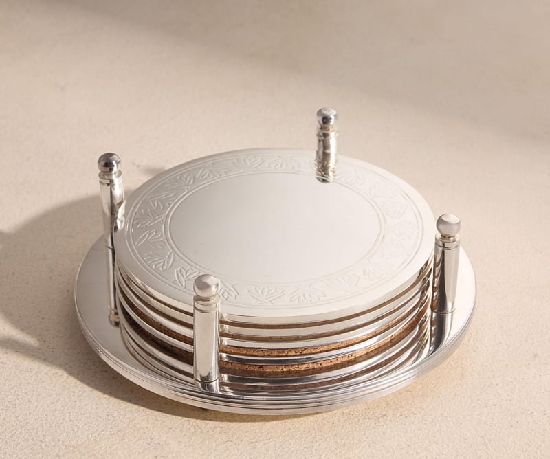 a set of silver engraved coasters.