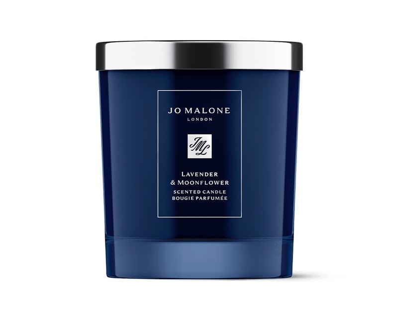 a dark blue jar Jo Malone candle with silver lid.