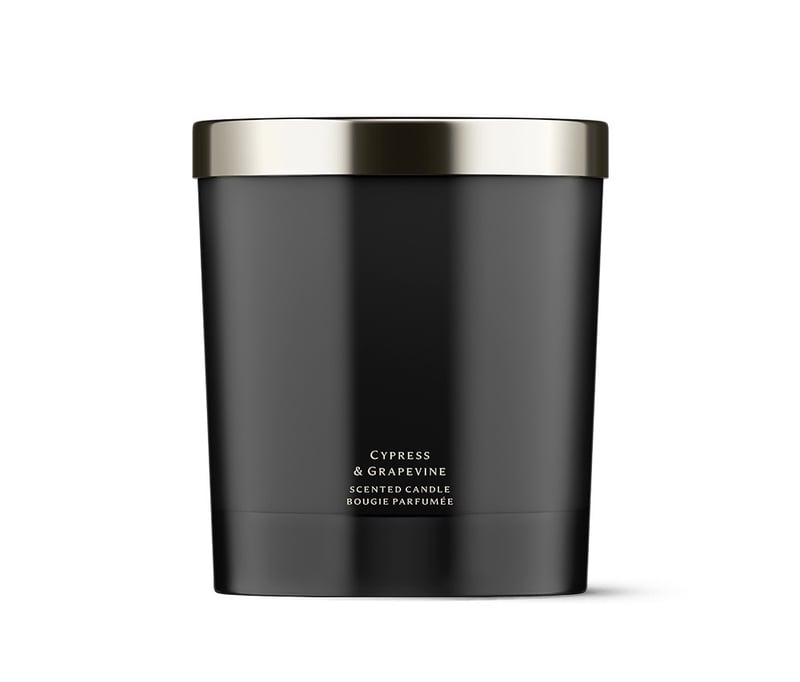 a black luxury jar candle with silver lid.