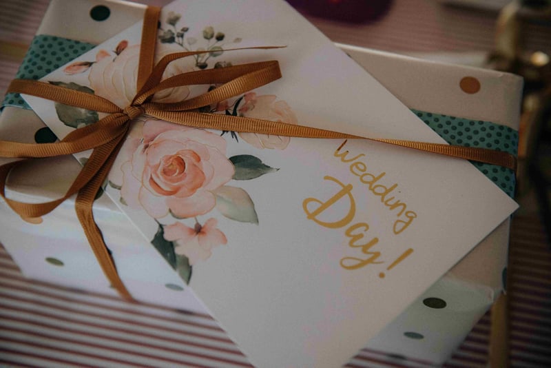 a wedding present and card tied with gold ribbon.