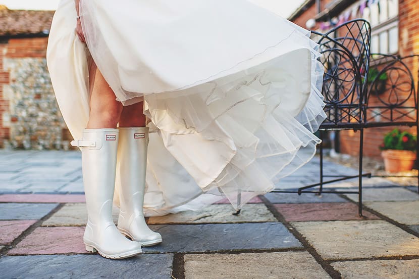 Bridebook.co.uk- bride wearing a pair of white weddingtons