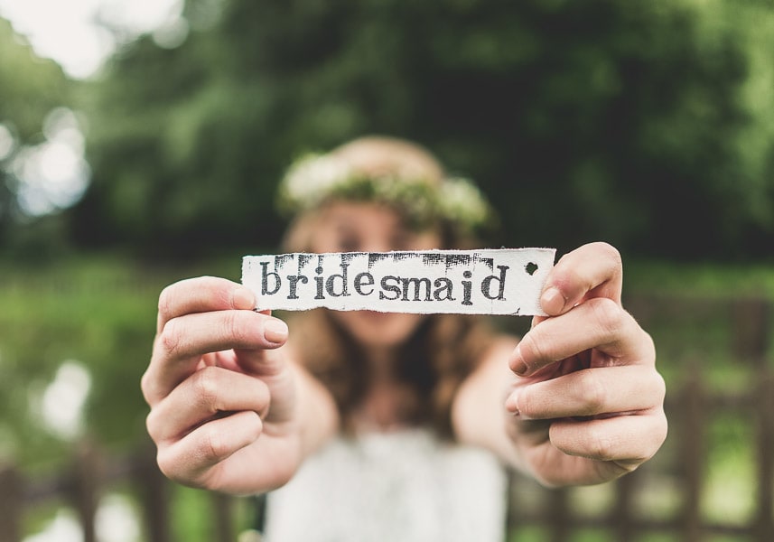 Bridebook.co.uk- bridesmaid holding a bridesmaid sign