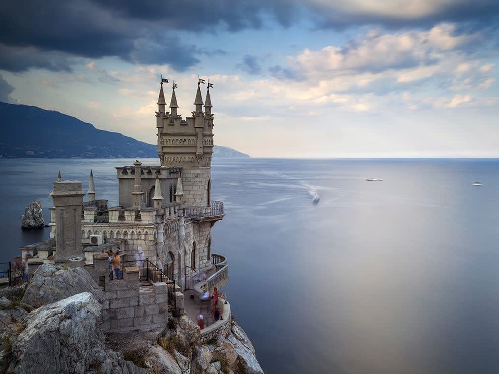 Bridebook.co.uk- castle standing on a cliff by the sea