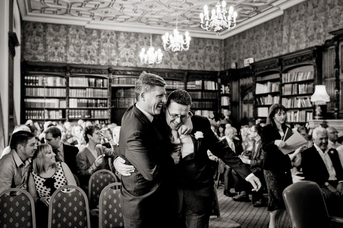 Bridebook.co.uk- groom and best man hug before the ceremony