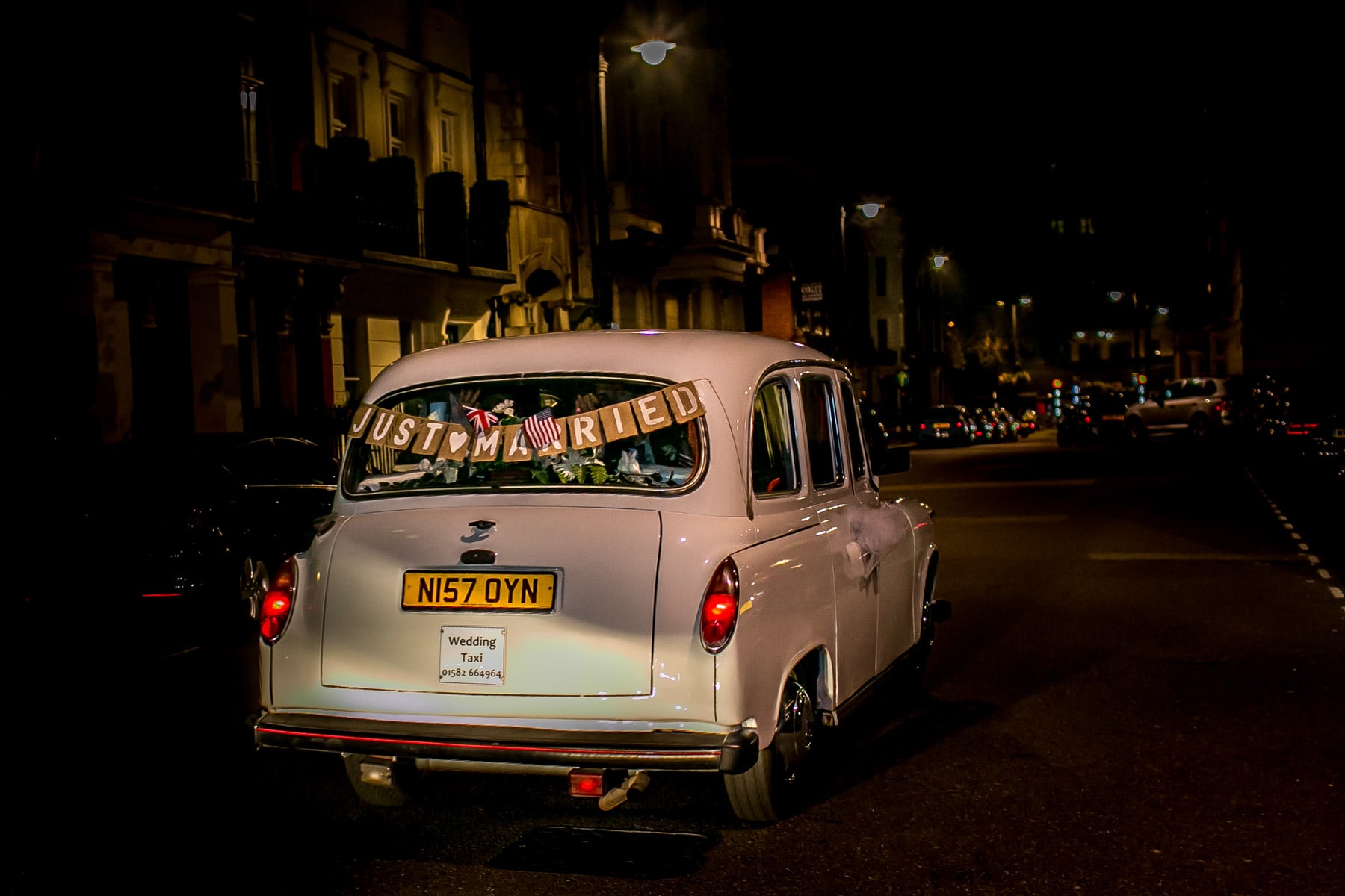 Bridebook.co.uk- wedding car with just married banner