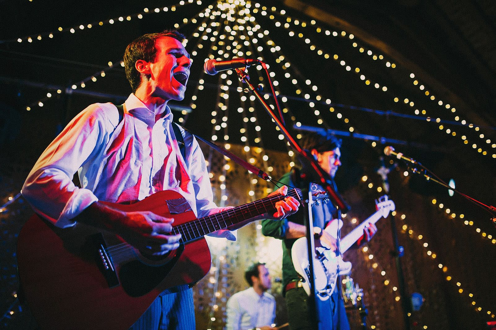 Bridebook.co.uk- wedding band playing at reception with the guitarist singing