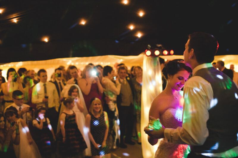 Bridebook.co.uk- bride and groom dancing as guests look on