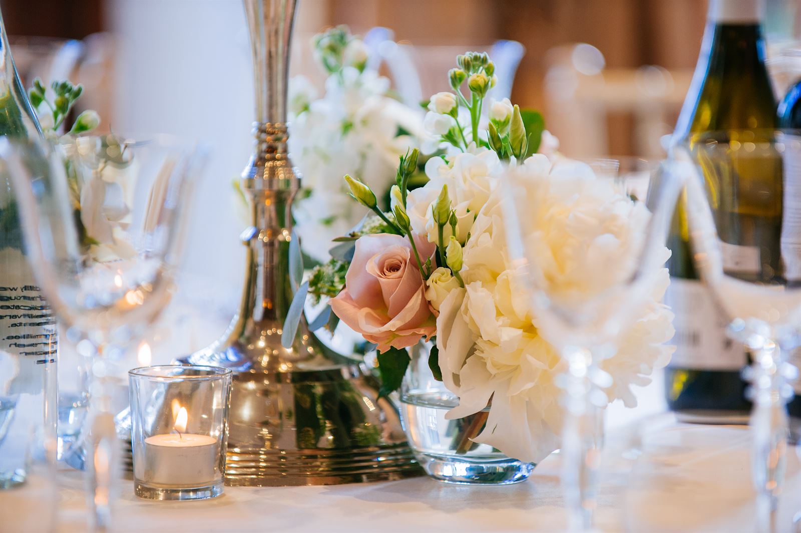 Bridebook.co.uk- table setting with flowers and candles