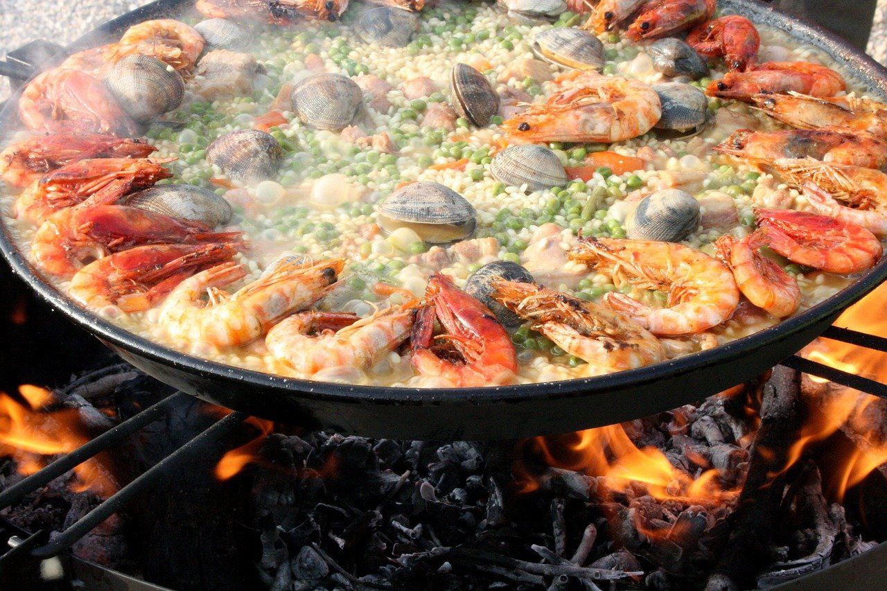 Flavoursome Spanish paella being cooked for wedding