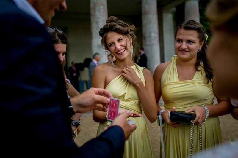 Bridebook.co.uk- bridesmaids being entertained by magician