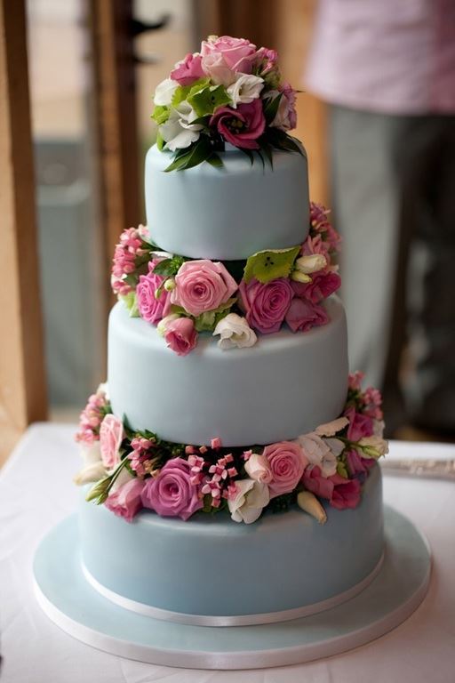 Bridebook.co.uk- three layer pale blue cake decorated with pink roses and lilies