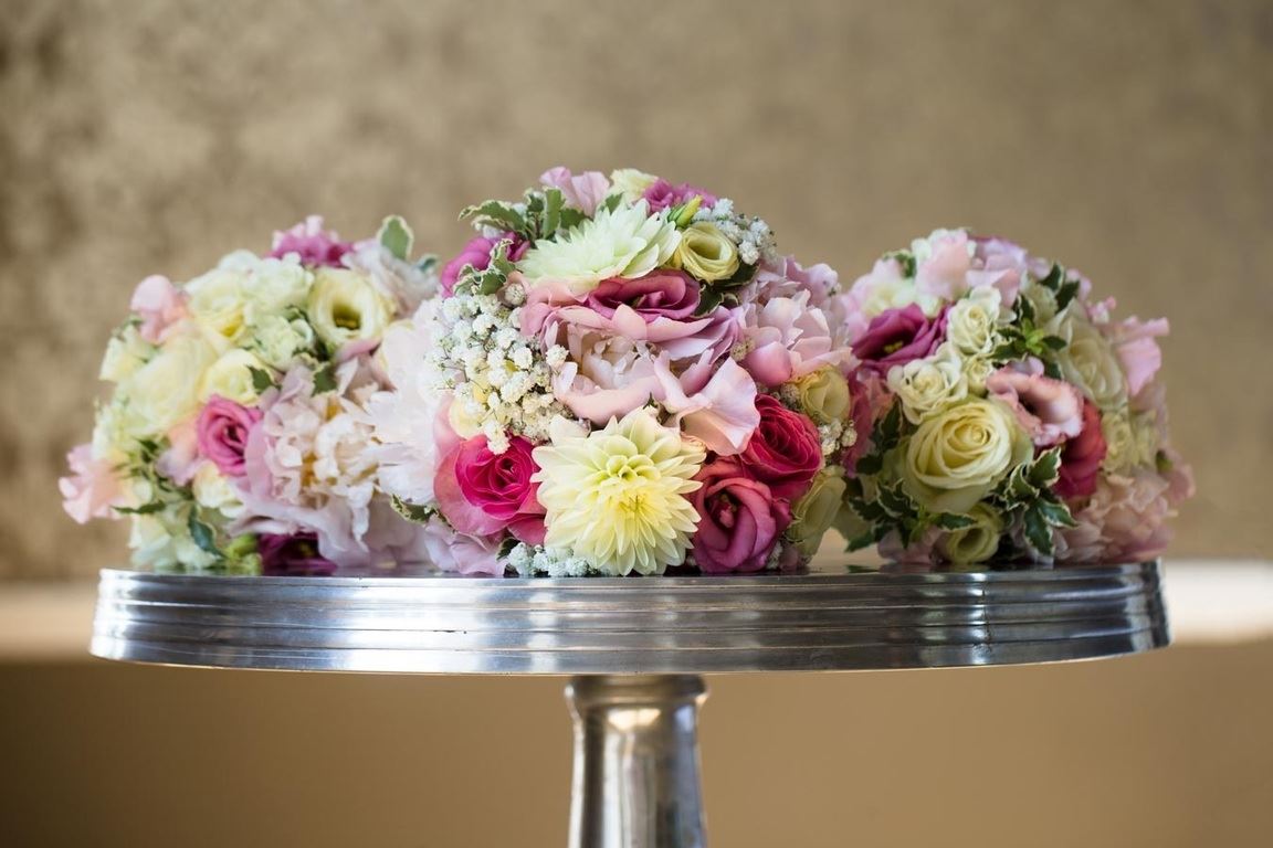 Bridebook.co.uk- wedding bouquets piled onto a table