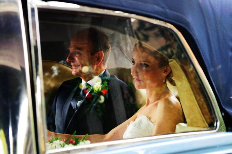 Bridebook.co.uk- bride and father in wedding car