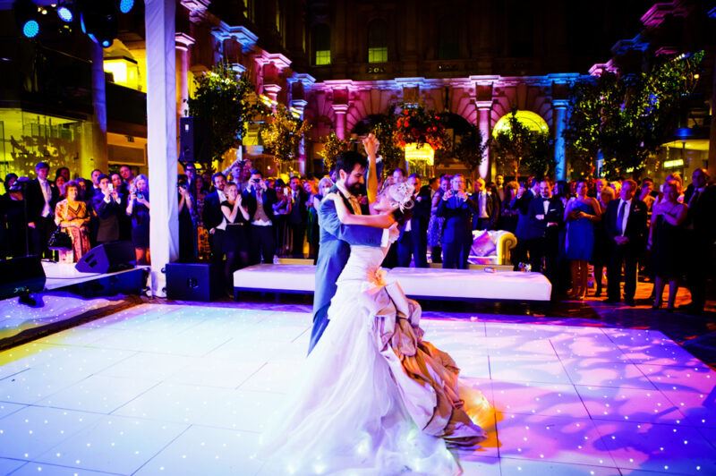 Bridebook.co.uk- bride and groom dancing as guests watch